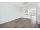 Open concept living room with hardwood floors and kitchen view at 801 Recess Pointe Dr # 55, Moncks Corner, SC 29461