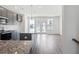 Open concept kitchen with granite island and access to deck at 803 Recess Pointe Dr # 54, Moncks Corner, SC 29461
