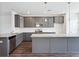 Modern kitchen with gray cabinets, granite countertops, and island at 803 Recess Pointe Dr # 54, Moncks Corner, SC 29461