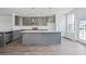 Modern kitchen with gray cabinets, granite countertops, and stainless steel appliances at 803 Recess Pointe Dr # 54, Moncks Corner, SC 29461