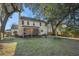 Large backyard with mature trees and screened porch at 8517 Falling Leaf Ln, North Charleston, SC 29420
