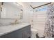 Modern bathroom with marble vanity, subway tile, and gold fixtures at 8517 Falling Leaf Ln, North Charleston, SC 29420