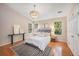 Spacious main bedroom with hardwood floors, large windows, and a neutral color palette at 8517 Falling Leaf Ln, North Charleston, SC 29420