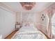 Bright bedroom with floral wall mural and soft natural light at 8517 Falling Leaf Ln, North Charleston, SC 29420