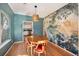 Charming dining room with hardwood floors and mural at 8517 Falling Leaf Ln, North Charleston, SC 29420