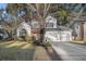 Two-story house with a two-car garage and landscaped yard at 8517 Falling Leaf Ln, North Charleston, SC 29420