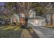 Two-story house with a two-car garage, lit at night at 8517 Falling Leaf Ln, North Charleston, SC 29420