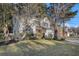 Two-story house with a two-car garage and manicured lawn at 8517 Falling Leaf Ln, North Charleston, SC 29420