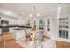 Bright kitchen with white cabinets, granite countertops, and stainless steel appliances at 8517 Falling Leaf Ln, North Charleston, SC 29420