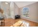 Bright living room with hardwood floors, high ceilings and piano at 8517 Falling Leaf Ln, North Charleston, SC 29420