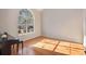 Spacious living room with hardwood floors and large window at 8517 Falling Leaf Ln, North Charleston, SC 29420