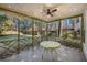 Relaxing screened porch with string lights and patio furniture at 8517 Falling Leaf Ln, North Charleston, SC 29420