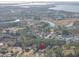 Aerial view of home nestled in a quiet neighborhood near water at 1081 Saint Thomas Island Dr, Charleston, SC 29492