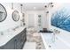 Elegant bathroom with double vanity, soaking tub, and herringbone tile floor at 1081 Saint Thomas Island Dr, Charleston, SC 29492