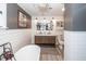 Elegant bathroom with double vanity, freestanding tub, and a walk-in shower at 1081 Saint Thomas Island Dr, Charleston, SC 29492