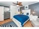 Coastal-themed bedroom with white bed frame and blue bedding at 1081 Saint Thomas Island Dr, Charleston, SC 29492