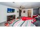 Main bedroom with a barn door, fireplace, and a large TV at 1081 Saint Thomas Island Dr, Charleston, SC 29492