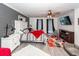 Spacious bedroom with a king-size bed, gray accent wall, and hardwood floors at 1081 Saint Thomas Island Dr, Charleston, SC 29492