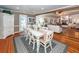 Bright dining room features a white farmhouse table with seating for six, and hardwood floors at 1081 Saint Thomas Island Dr, Charleston, SC 29492