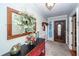 Inviting entryway with decorative mirror and console table at 1081 Saint Thomas Island Dr, Charleston, SC 29492