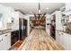 Open concept kitchen with a large butcher block island, stainless steel appliances and hardwood floors at 1081 Saint Thomas Island Dr, Charleston, SC 29492