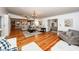 Open concept living area with hardwood floors and multiple seating areas at 1081 Saint Thomas Island Dr, Charleston, SC 29492