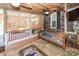 Spacious screened porch with a daybed and ceiling fans, offering a relaxing outdoor space at 1081 Saint Thomas Island Dr, Charleston, SC 29492