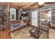 Relaxing screened porch with a daybed, wicker furniture, and ceiling fans at 1081 Saint Thomas Island Dr, Charleston, SC 29492