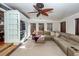Sunroom boasts a comfy sectional sofa and built-in entertainment center at 1081 Saint Thomas Island Dr, Charleston, SC 29492