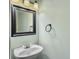 Small bathroom with a pedestal sink and framed mirror at 173 Hainsworth Dr, North Charleston, SC 29418