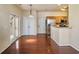 Hardwood floor dining room with access to kitchen and backyard at 173 Hainsworth Dr, North Charleston, SC 29418