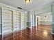 Empty dining room with hardwood floors and built-ins at 173 Hainsworth Dr, North Charleston, SC 29418
