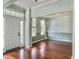 Light and airy entryway with hardwood floors and white front door at 173 Hainsworth Dr, North Charleston, SC 29418