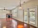 Gathering room featuring hardwood floors, fireplace, and French doors to patio at 173 Hainsworth Dr, North Charleston, SC 29418