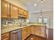 Modern kitchen with granite countertops and wood cabinets at 173 Hainsworth Dr, North Charleston, SC 29418