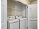 Laundry room with LG washer and dryer, and ample shelving at 173 Hainsworth Dr, North Charleston, SC 29418