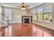 Bright living room with hardwood floors, fireplace, and large windows at 173 Hainsworth Dr, North Charleston, SC 29418