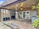 Covered patio with stone fireplace and access to pool at 173 Hainsworth Dr, North Charleston, SC 29418