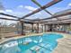 Kidney-shaped pool with covered patio and outdoor seating at 173 Hainsworth Dr, North Charleston, SC 29418