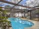 Enclosed kidney-shaped pool with a wooden pergola cover at 173 Hainsworth Dr, North Charleston, SC 29418