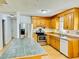 Spacious kitchen features stainless steel appliances and wood cabinets at 1966 Suzanne St, Johns Island, SC 29455