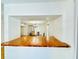 Simple kitchen with a wooden counter and view into dining area at 1966 Suzanne St, Johns Island, SC 29455