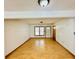 Simple living room with light colored wood flooring and a door at 1966 Suzanne St, Johns Island, SC 29455