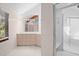 Elegant bathroom with light-colored tile, double vanity, and shower at 2942 Seabrook Island Rd, Seabrook Island, SC 29455
