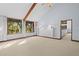 Bright bedroom featuring a high ceiling, large windows, and built-in shelves at 2942 Seabrook Island Rd, Seabrook Island, SC 29455
