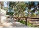 Wooden deck overlooks a lush, wooded backyard with water views at 2942 Seabrook Island Rd, Seabrook Island, SC 29455
