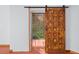 Rustic barn door separates rooms with tiled floors at 2942 Seabrook Island Rd, Seabrook Island, SC 29455