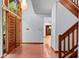 Bright entryway with tile floors, wood staircase, and double doors at 2942 Seabrook Island Rd, Seabrook Island, SC 29455