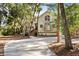 Front view of two-story house with circular driveway at 2942 Seabrook Island Rd, Seabrook Island, SC 29455