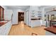Kitchen features white cabinets, wood floors, and copper countertops at 2942 Seabrook Island Rd, Seabrook Island, SC 29455